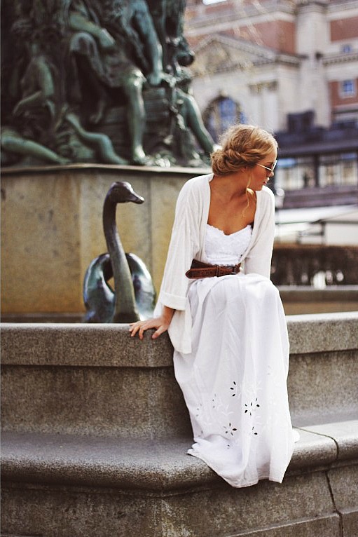 white dress by fountain